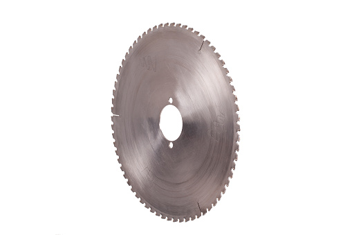 Massive circular saw blade made from steel metal isolated on a white background