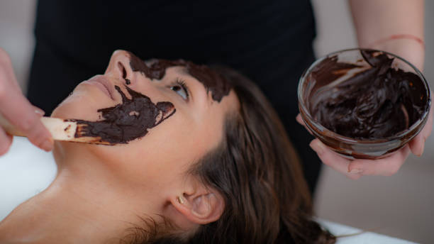 istock Pure relaxation with a decadent chocolate face mask massage, offering a delightful blend of skincare 1951976037