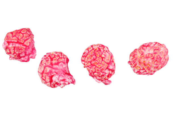 istock Pink glazed popcorn isolated on white background. 1951977598