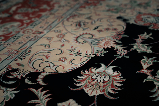 Close-up of the floral pattern on the Persian carpet.