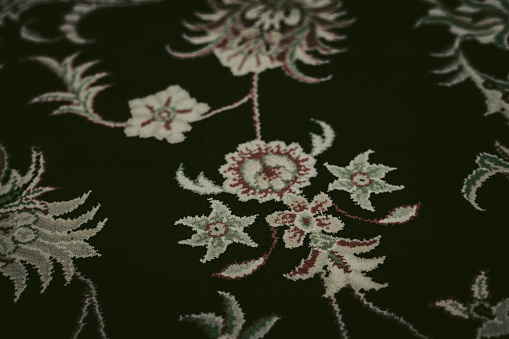 Close-up of the floral pattern on the Persian carpet.