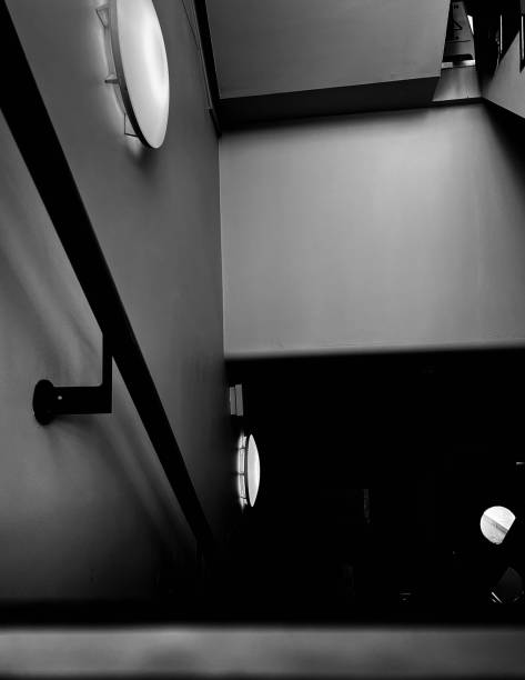 istock A staircase dimly lit by wall lights 1951991140