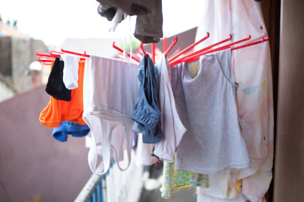Close-up of colorful laundry hanging on a balcony,seasonal clothing changes