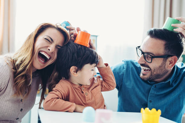 istock Parents and a child playing together 1952026391