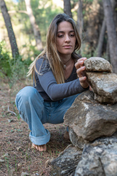 istock Girl making a rocks pyramid 1952055600