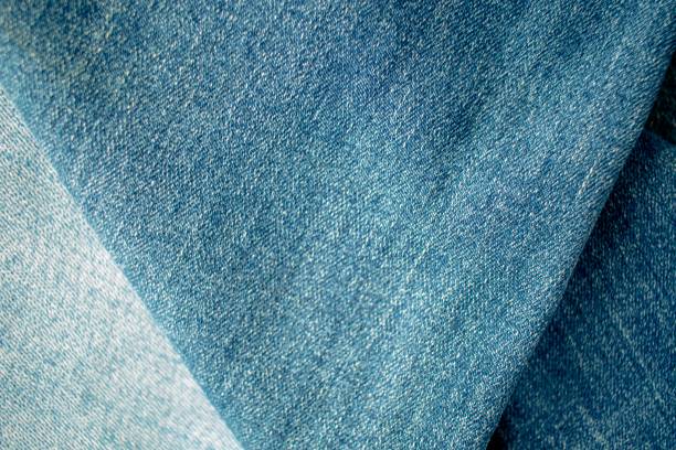 istock Blue  jeans texture or denim background with seam and thread, textile material 1952061436