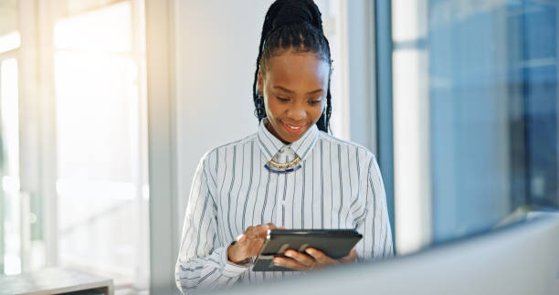 istock Business woman, tablet and thinking in office with internet, creative idea or communication. African entrepreneur person with technology for networking, online planning or email and social media 1952068442