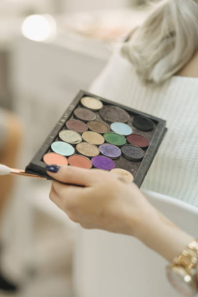 istock Work table of make-up artist with cosmetics and brushes 1952077113