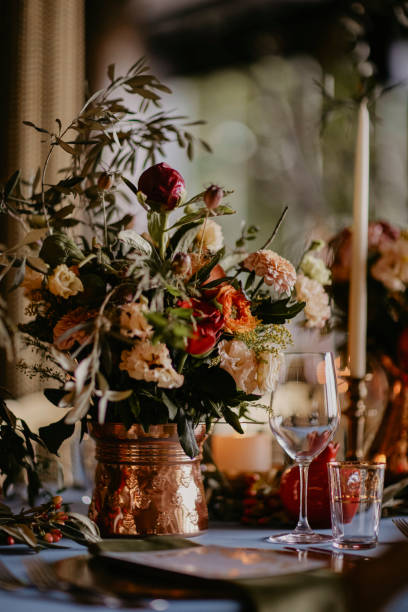 istock bohemian style wedding dining table decorated with a blue covered bronze vase and pomegranate figures. stock photo 1952092235