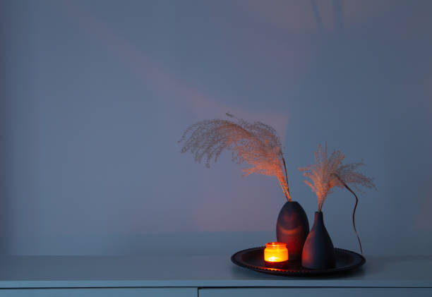 home decor with dried flowers and burning candles