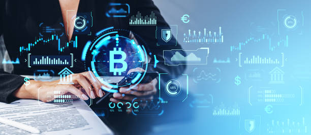 istock Woman working with smartphone, glowing bitcoin dashboard with statistics 1952117872