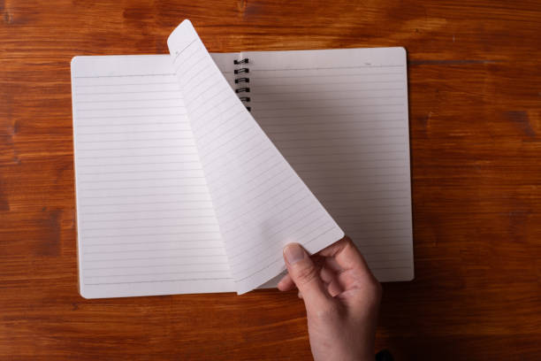 istock person turning pages 1952120673