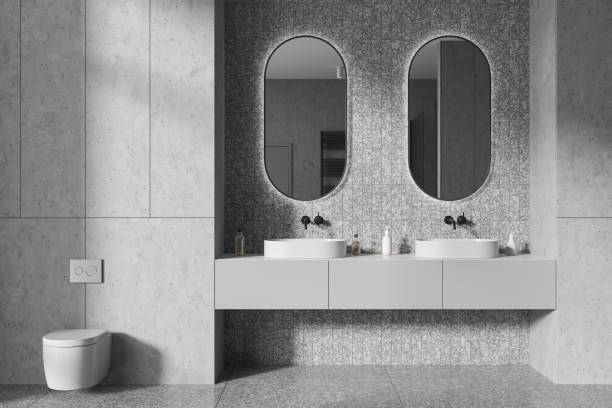 istock White bathroom interior with double sink and toilet 1952121752