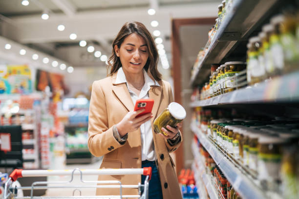 istock Female customer shopping with smartphone checklist 1952122826