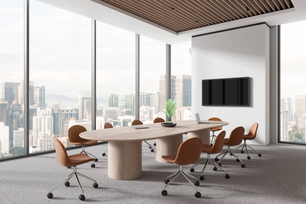 istock Modern conference room interior with meeting board and chairs, tv and window 1952128377