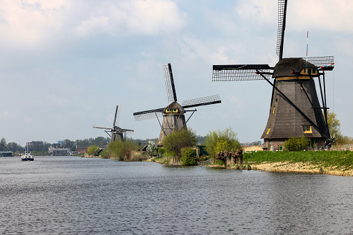 Kinderdijk, the Netherlands - April 17, 2023: The windmills at Kinderdijk, the Netherlands, a UNESCO world heritage site. Built about 1740 system19 windmills is part of a larger water management system to prevent flooding.
