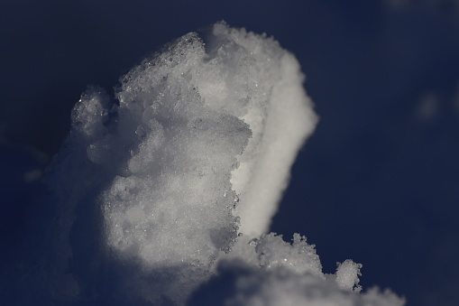 Overhead shot of misty hills covered in snow.