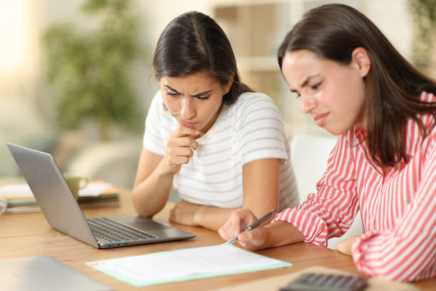 istock Suspicious tele workers checking contract at home 1952171682