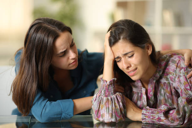 istock Good friend comforting a sad woman 1952178123