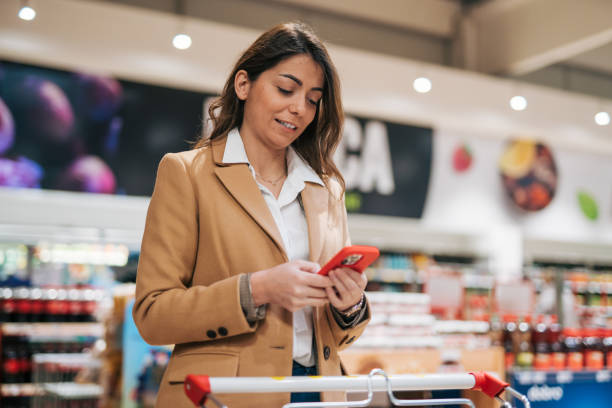 istock Female customer shopping with smartphone checklist 1952179232