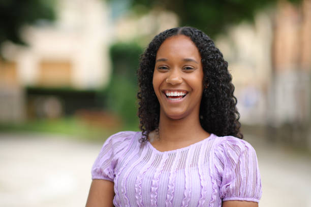 istock Black woman with perfect teeth laughing at camera 1952179245