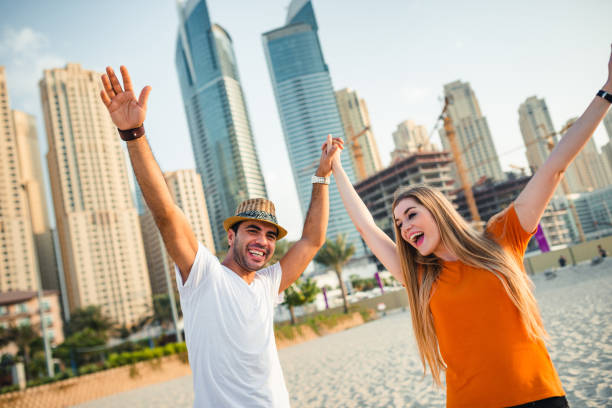 istock couple together at the beach in Dubai 1952193223