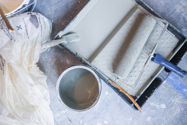 Paint roller and brush on a paint tray, ready for some home decorating and home improvement