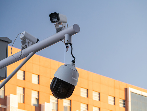 Close up of CCTV camera over defocused background with copy space