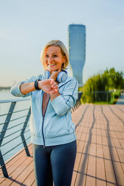 istock Mature woman checking her pulse after a run 1952241343