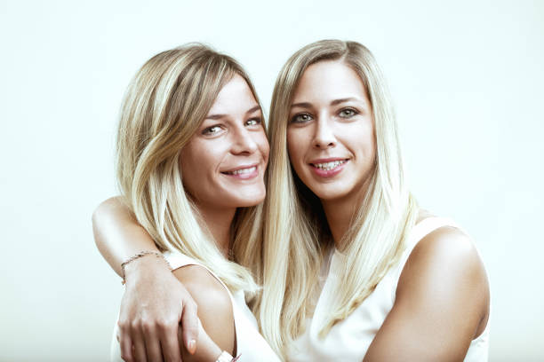 istock two smiling women share affectionate, joyful embrace 1952261292
