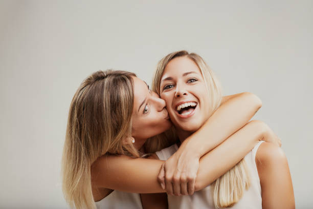 istock Tender friendship moment captured in affectionate kiss 1952262366