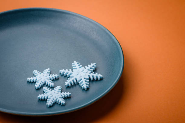 istock Beautiful winter snowflakes on a plain background with copy space 1952265495