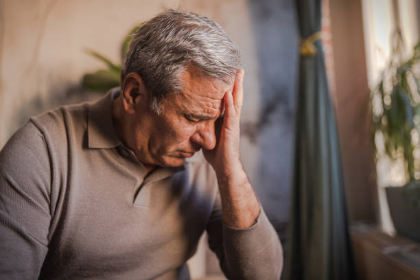 istock Stressed, unhappy man with severe headache 1952266540