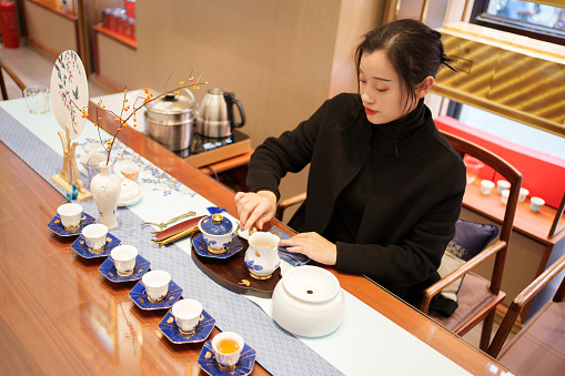 woman making tea