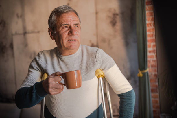 istock A disabled person walks with crutches 1952281938