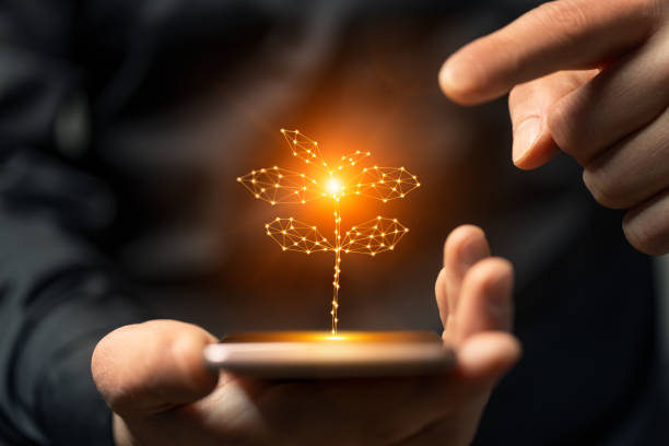 Artificial intelligence new life plant symbol on smartphone in hand. This file is cleaned and retouched.