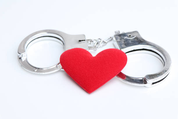 istock red heart and shackle, The concept of love and commitment 1952291529