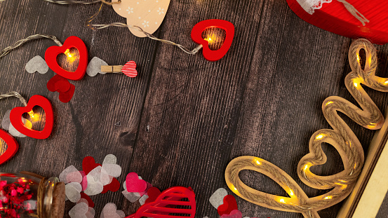 Background for Valentine's Day on wooden boards.
