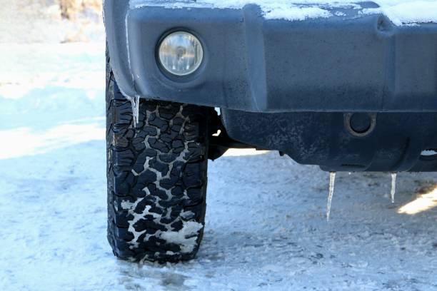 istock a car is covered in ice on the road as it approaches 1952335009