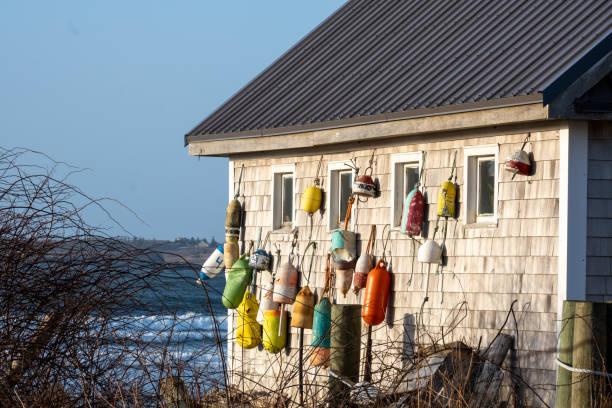Colourful fishing boats. A tranquil setting with dock and fishing gear.