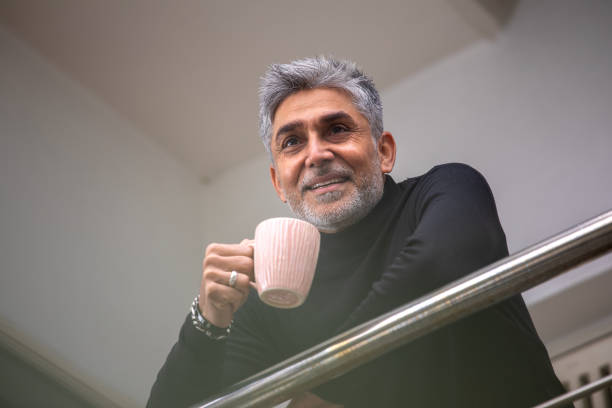 istock Happy senior man contemplating in balcony 1952342191