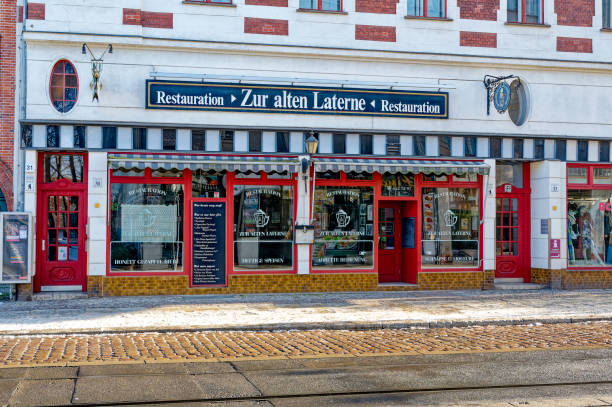 Berlin, Germany - January 19, 2024: Street scene with a traditional restaurant in the old city Berlin-Koepenick.