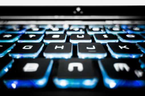 Blue glowing laptop keyboard