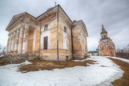 Russia. Torzhok. Architecture of the Russian monastery of the 18th century named after Boris and Gleb. Ancient buildings with columns, bell tower. Shooting at a wide angle. Soft focus.