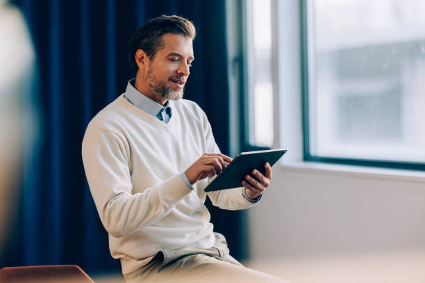 istock Corporate Focus: Businessman and His Tablet 1952380523
