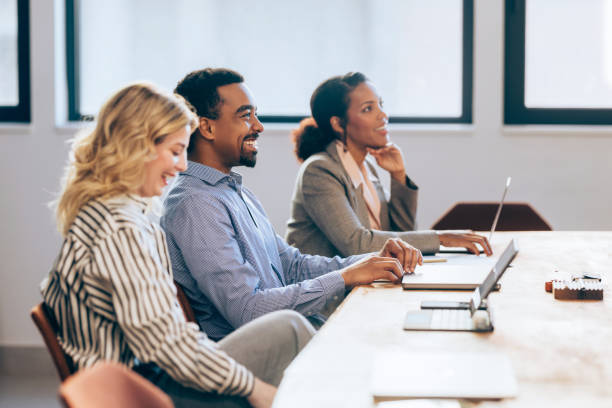 istock Strategic Minds at Work: Smiling Business Team Meeting 1952381077