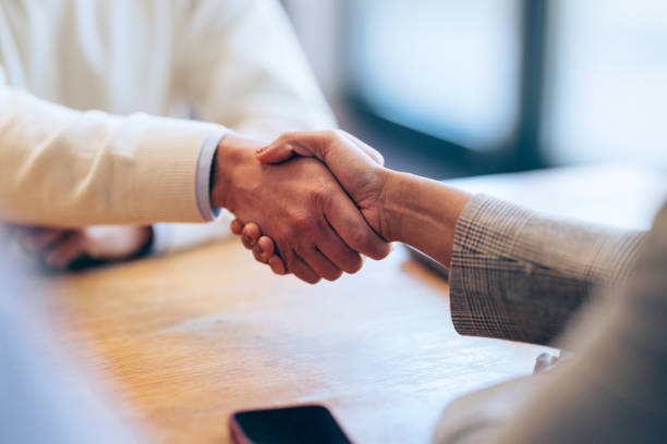 istock Sealing the Deal: a Business Handshake in Close Up 1952381616