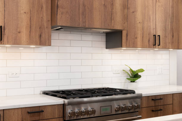 istock A kitchen detail with wood cabinets and white subway tile backplash. 1952386688