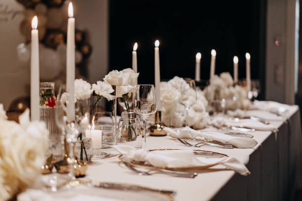 istock Beautifully arranged table adorned with candles prepared for dinner guests 1952404271