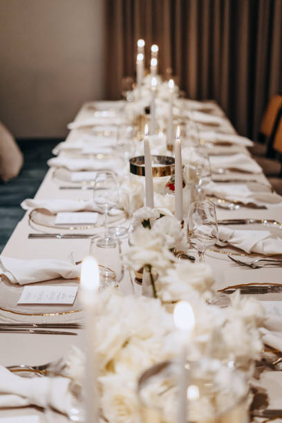 istock Beautifully arranged table adorned with candles prepared for dinner guests 1952404282
